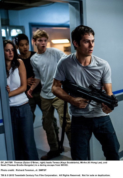 MAZE RUNNER: THE SCORCH TRIALS Thomas (Dylan O’Brien, right) leads Teresa (Kaya Scodelario), Minho (Ki Hong Lee), and Newt (Thomas Brodie-Sangster) in a daring escape from WCKD. Photo credit:  Richard Foreman, Jr. SMPSP TM and © 2015 Twentieth Century Fox Film Corporation.  All Rights Reserved.  Not for sale or duplication.